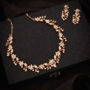 "Woman wearing minimalist gold necklace paired with white blouse"