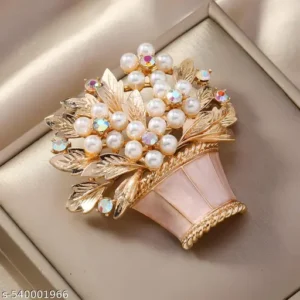 "Elegant gold-toned brooch pin with floral design"